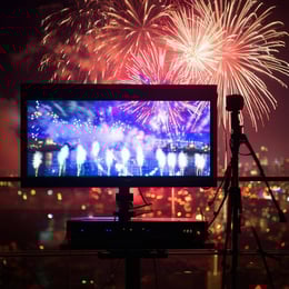 A TV broadcoast of the News years eve countdown with the fireworks starting