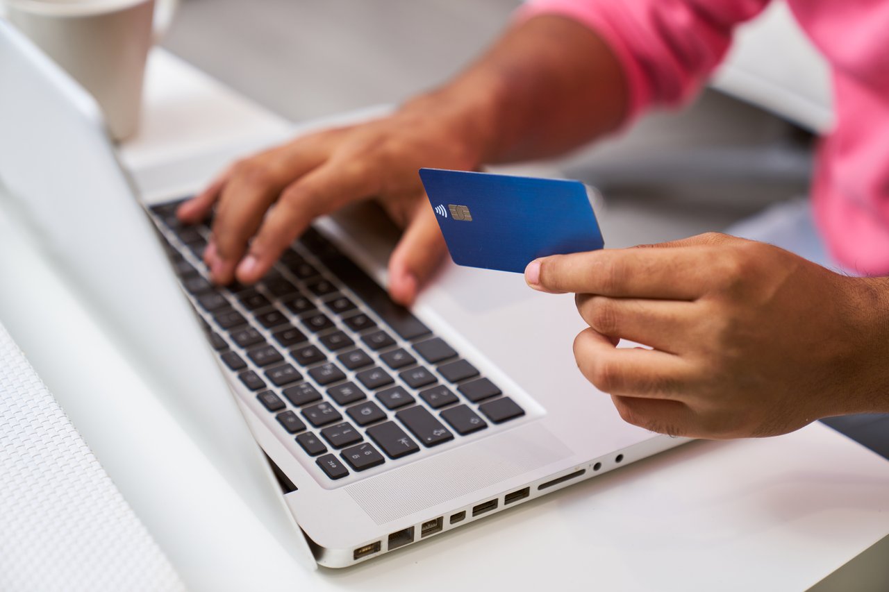 unrecognizable-man-shopping-online-making-payment-2024-11-28-12-12-37-utc